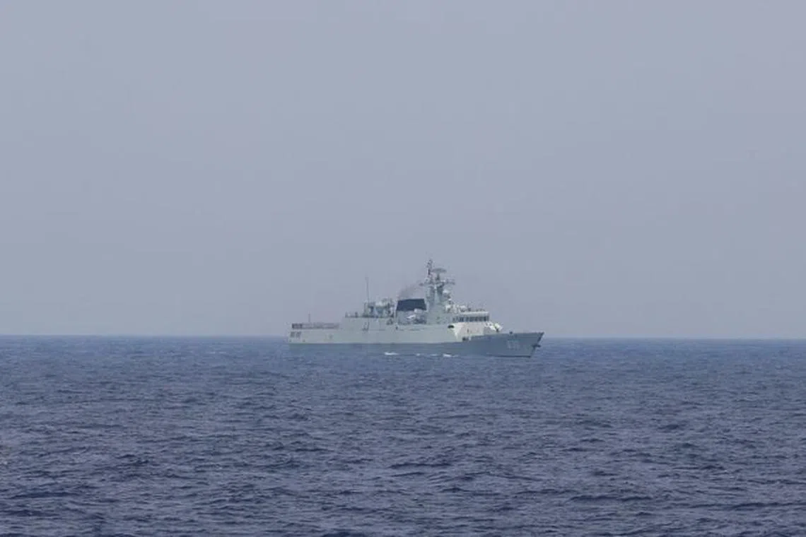 FILE PHOTO: A Chinese navy ship is seen sailing in the South China Sea, October 4, 2023. REUTERS/Adrian Portugal
