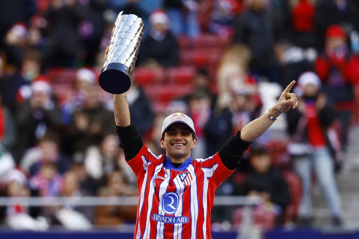 FILE PHOTO: Soccer Football - LaLiga - Atletico Madrid v Getafe - Metropolitano, Madrid, Spain - December 15, 2024 MotoGP world champion Jorge Martin holds his trophy before the match REUTERS/Susana Vera/File Photo