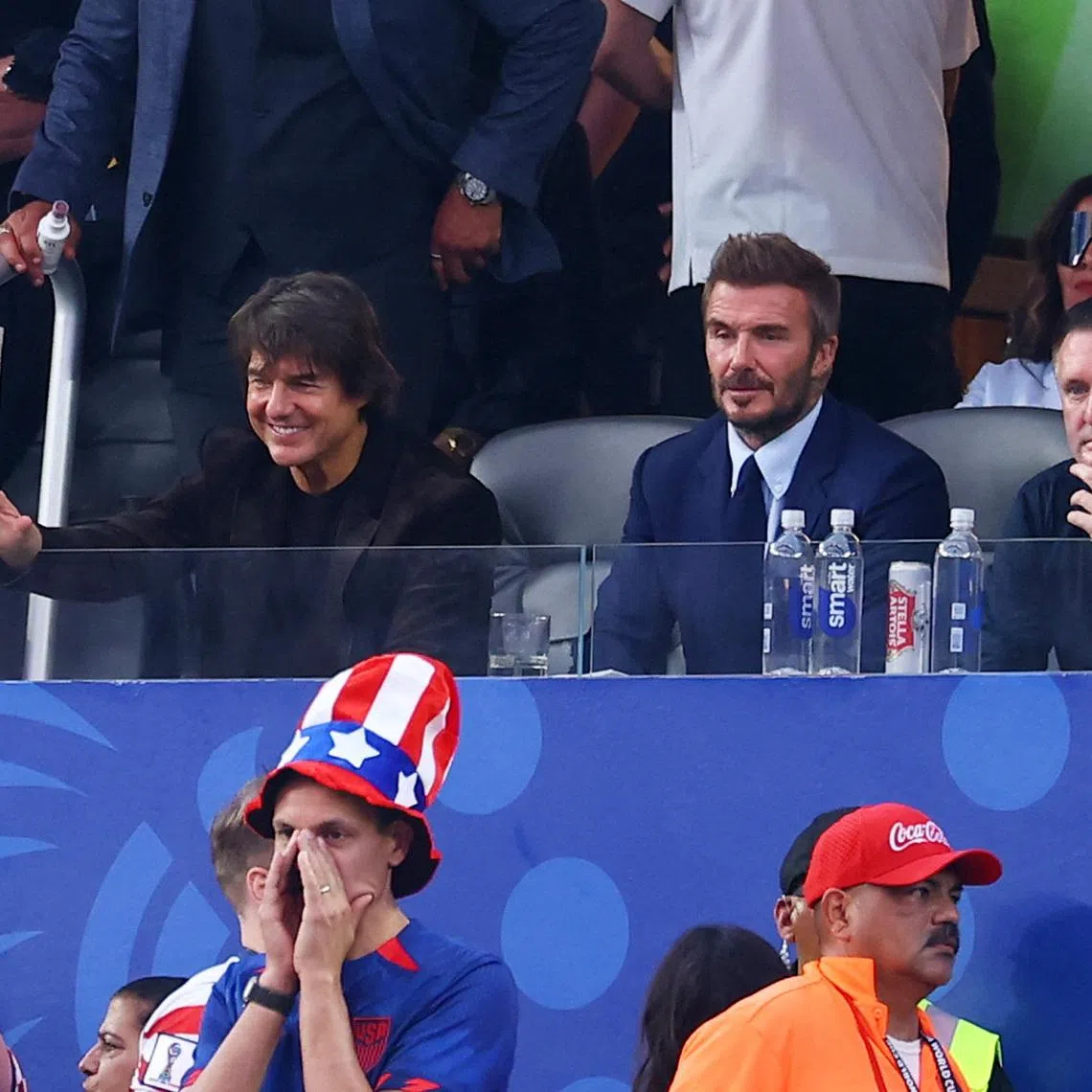(From left) Actor Tom Cruise and former footballers David Beckham and Robbie Keane in the stands of the US vs Paraguay match on June 12.