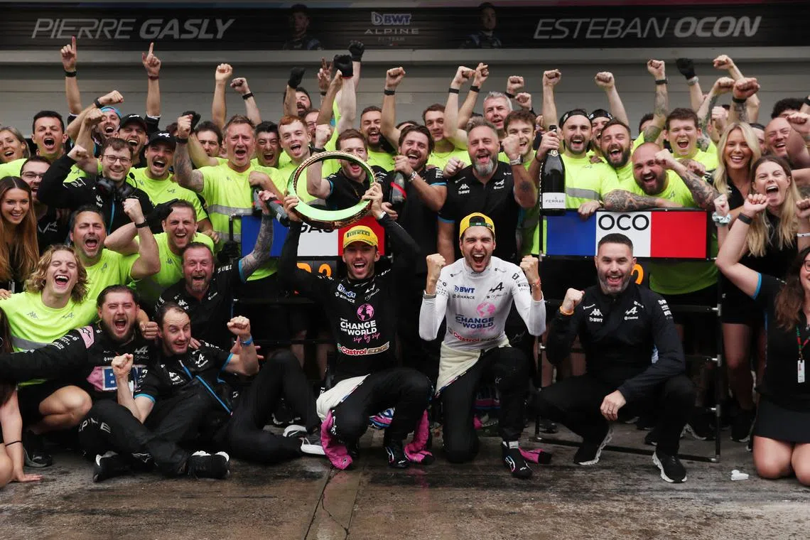 Esteban Ocon (squatting, second from right) and Pierre Gasly (left of Ocon) finished second and third respectively at the Brazilian Grand Prix on Nov 3 to lift Alpine from ninth to sixth place in the constructors’ championship.