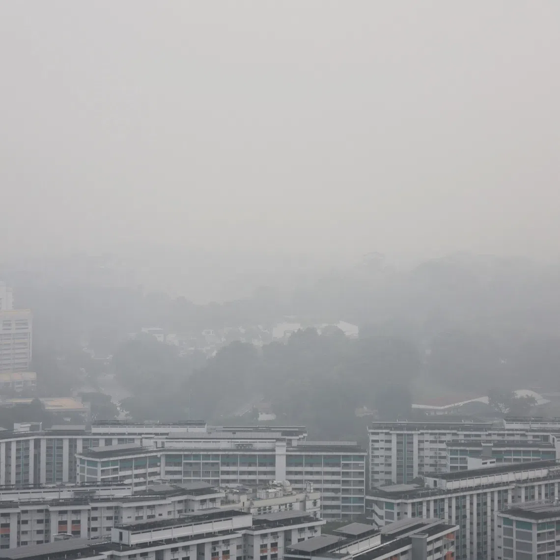 Hazy conditions seen from Clementi rea at about 7.10am on Oct 17.