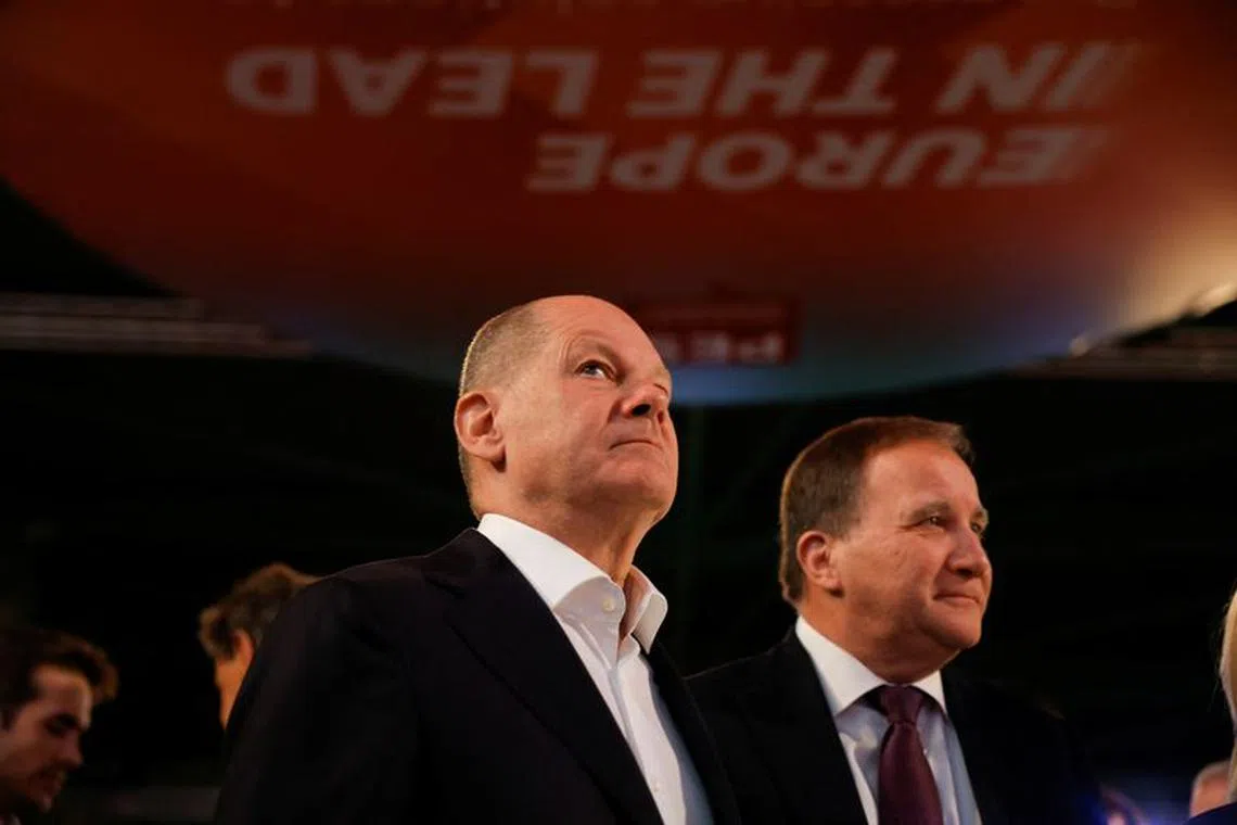 German Chancellor Olaf Scholz looks on next to the President of the Party of European Socialists (PES) Stefan Lofven during the meeting of the Party of European Socialists in Malaga, Spain, November 11, 2023. REUTERS/Jon Nazca