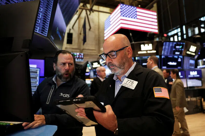 A trader works on the floor at the New York Stock Exchange in New York City, US, on Sept 22, 2025.