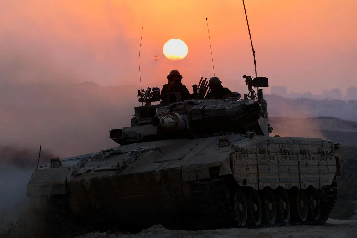 An Israeli tank manoeuvres, amid the Israel-Hamas conflict, near the Israel-Gaza border, in Israel, July 9, 2024. REUTERS/Amir Cohen/File Photo