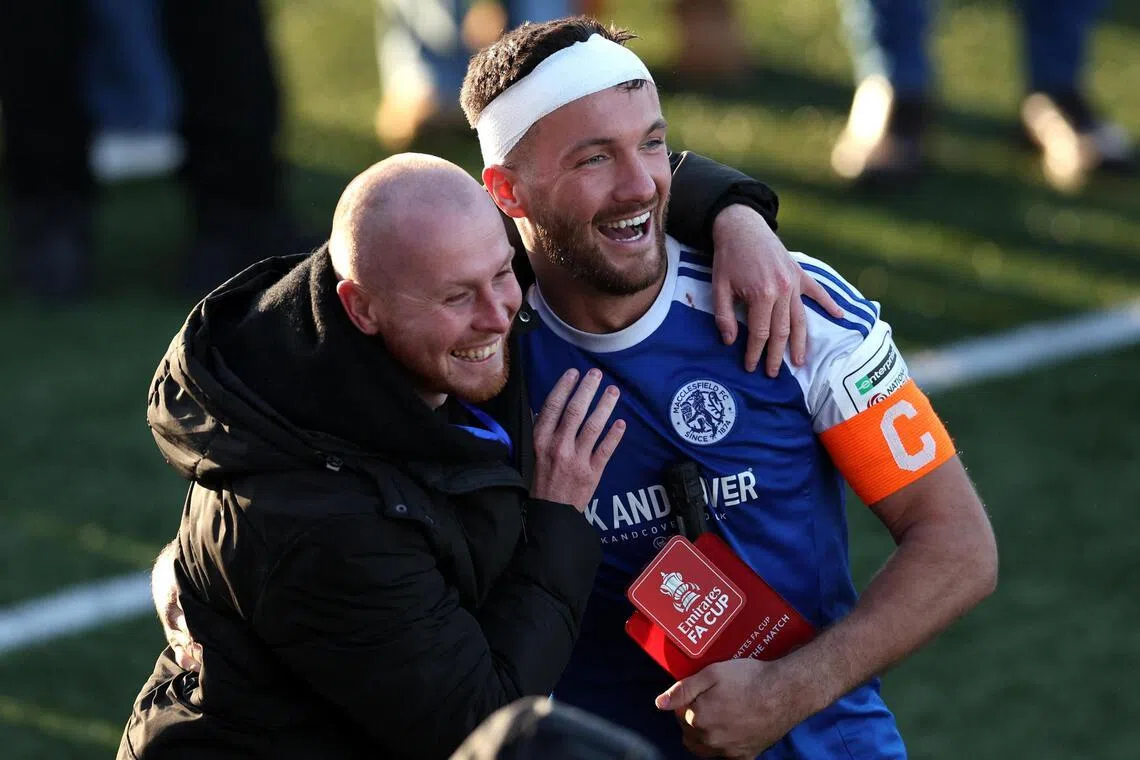 Macclesfield captain Paul Dawson, who scored one of the team's two goals, celebrates after the match.