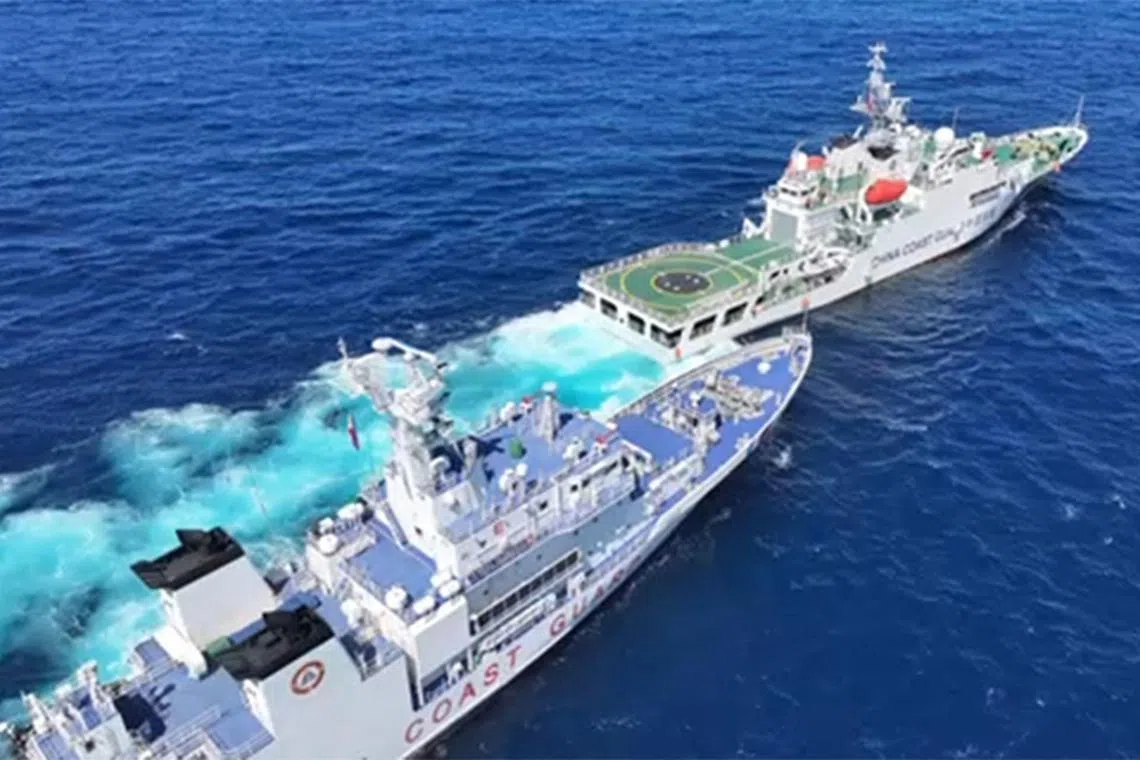 This frame grab from handout video taken on February 8, 2024 and released by the Philippine Coast guard (PCG) on February 11, shows a Chinese coast guard vessel (front R) blocking and sailing past Philippine coast guard ship BRP Teresa Magbanua (back L) near Scarborough Shoal, in the disputed South China Sea. The Philippine Coast Guard on February 11 accused Chinese vessels of "dangerous" manoeuvres during a nine-day patrol near a reef off the coast of the Southeast Asian country. (Photo by Handout / Philippine Coast Guard (PCG) / AFP) / RESTRICTED TO EDITORIAL USE - MANDATORY CREDIT "AFP PHOTO / PHILIPPINE COAST GUARD" - NO MARKETING NO ADVERTISING CAMPAIGNS - DISTRIBUTED AS A SERVICE TO CLIENTS