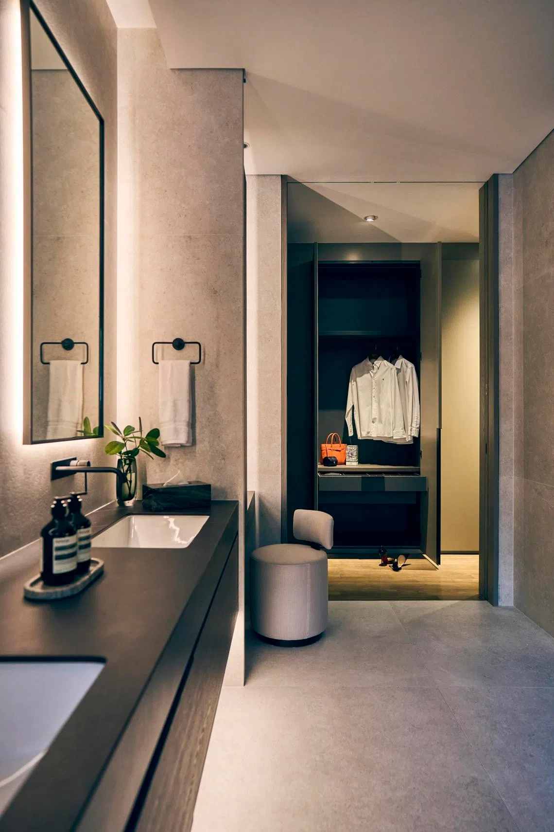 The bathroom is next to the wardrobe, so the owners can go from grooming to dressing with ease.