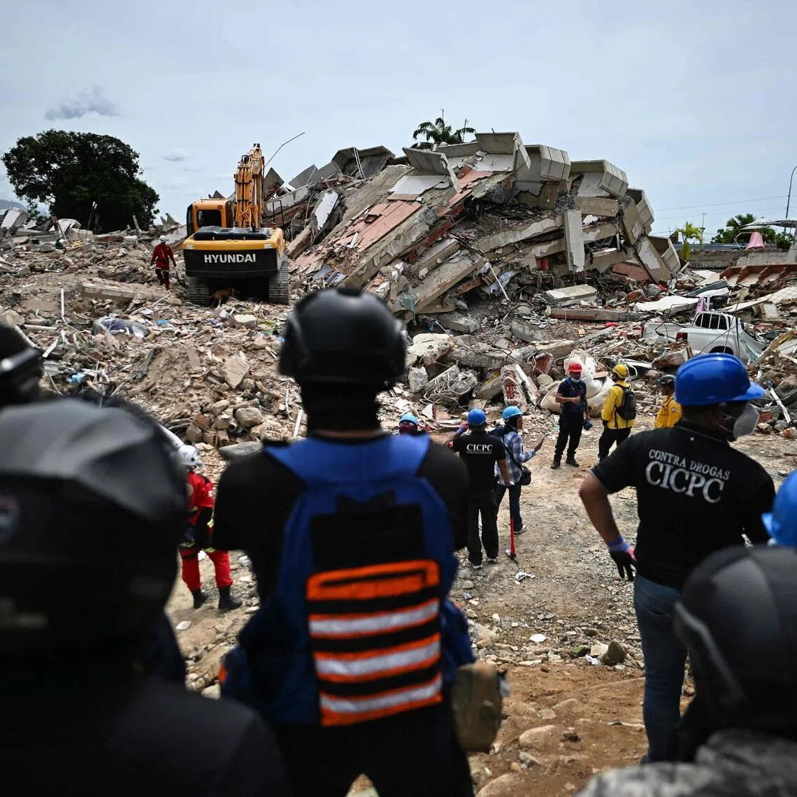 Rescuers carry out sound tests in search of survivors following the June 24 twin earthquakes, in Caraballeda, La Guaira state, Venezuela, on June 30.