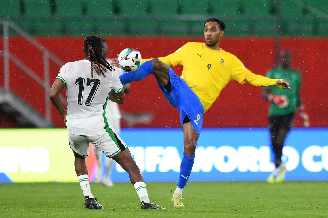 Soccer Football - FIFA World Cup - CAF Qualifiers - Playoffs - Semi Final - Nigeria v Gabon - Prince Moulay Hassan Stadium, Rabat, Morocco - November 13, 2025 Nigeria's Alex Iwobi in action with Gabon's Pierre-Emerick Aubameyang REUTERS/Stringer