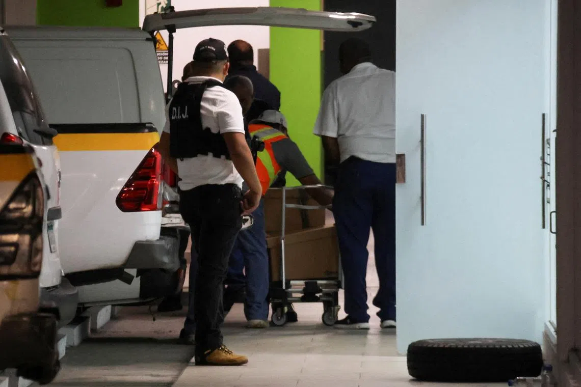 Members of Panama’s investigative police conduct a search at offices tied to the Panama Ports Company, the local unit of Hong Kong conglomerate CK Hutchison, and load boxes into a truck in an underground parking area in the upscale Albrook district of Panama City, Panama, February 26, 2026. REUTERS/Aris Martinez