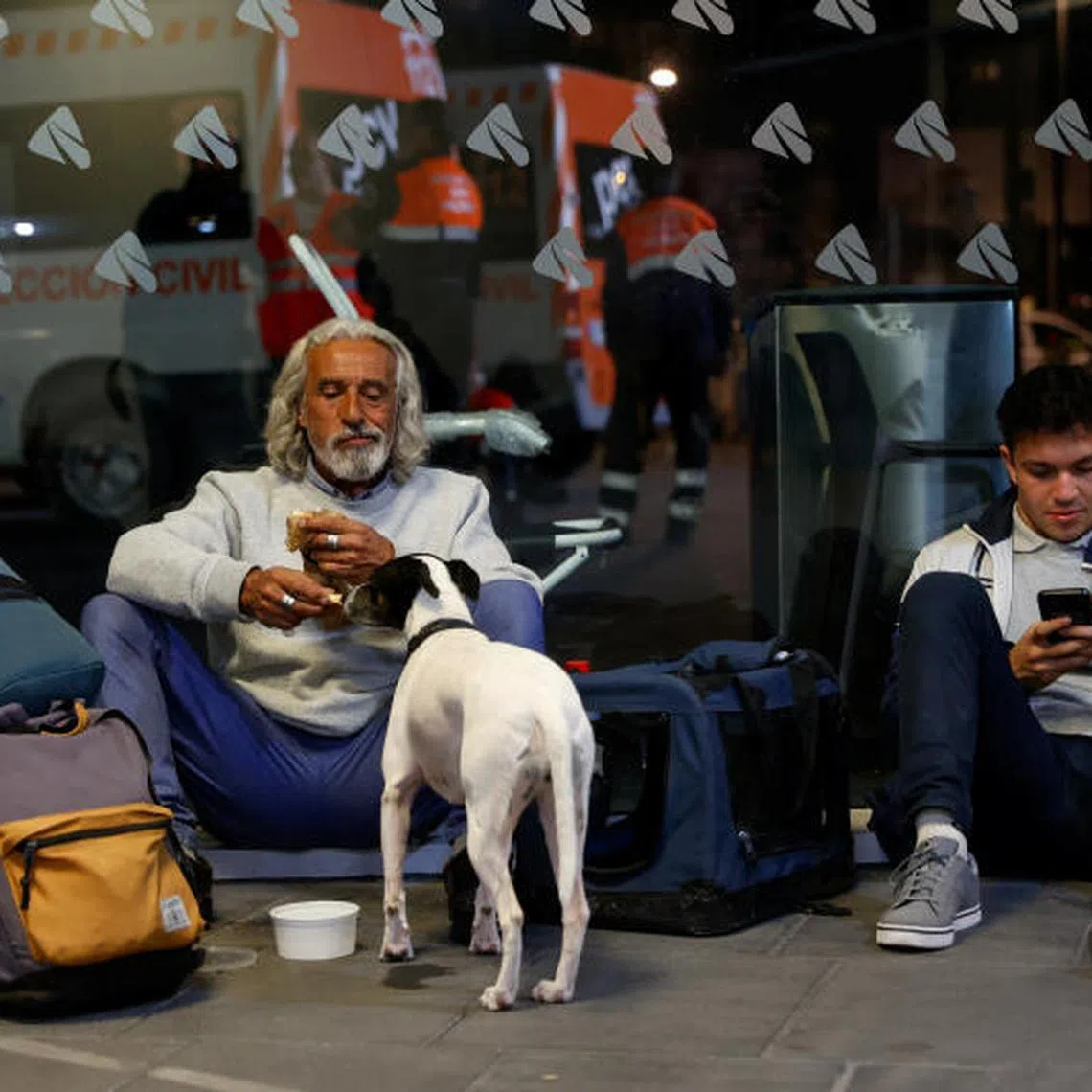 People with luggage sit on the floor at Joaquin Sorolla train station, as a power outage hit large parts of Spain, in Valencia, Spain, April 28, 2025. REUTERS/Eva Manez TPX IMAGES OF THE DAY