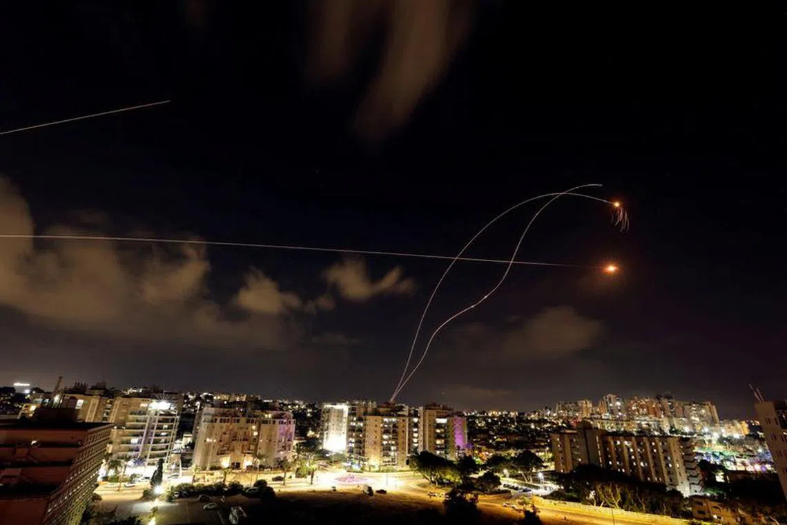 Israel's Iron Dome anti-missile system intercepts rockets launched from the Gaza Strip, as seen from Ashkelon in southern Israel October 10, 2023. REUTERS/Ronen Zvulun