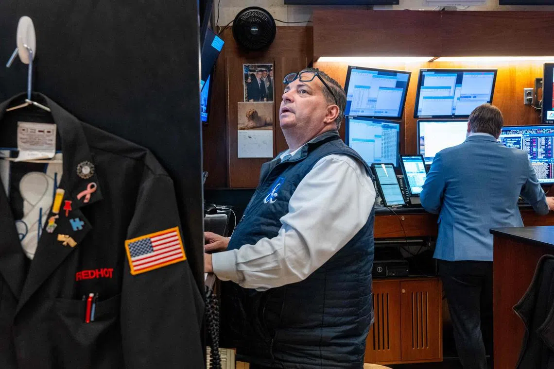 Traders work on the floor of the New York Stock Exchange, in New York City. 