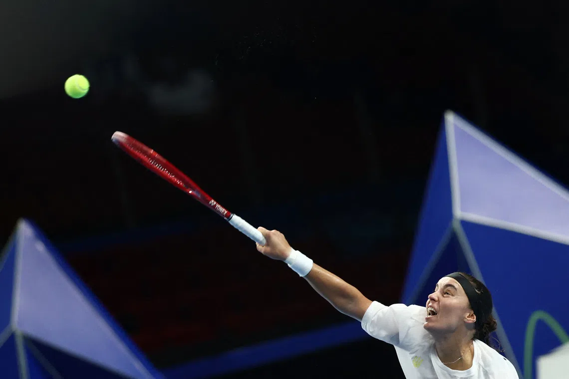 Tennis - Billie Jean King Cup Finals - Semi Final - Italy v Ukraine - Shenzhen Bay Sports Centre Arena, Shenzhen, China - September 26, 2026 Ukraine's Anhelina Kalinina in action during her match against Italy's Tyra Caterina Grant REUTERS/Tingshu Wang