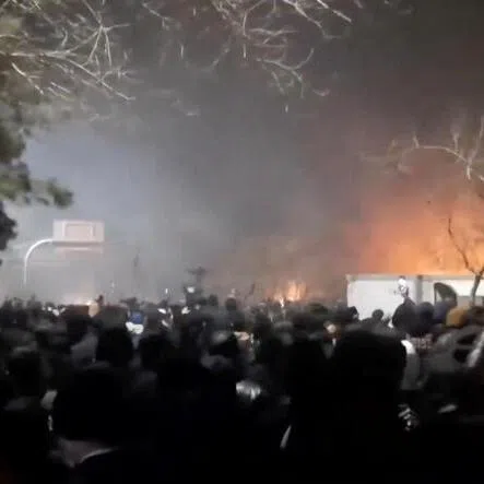 A screengrab from social media showing smoke rising as protesters gather amid anti-government unrest in Mashhad, Razavi Khorasan province, Iran.