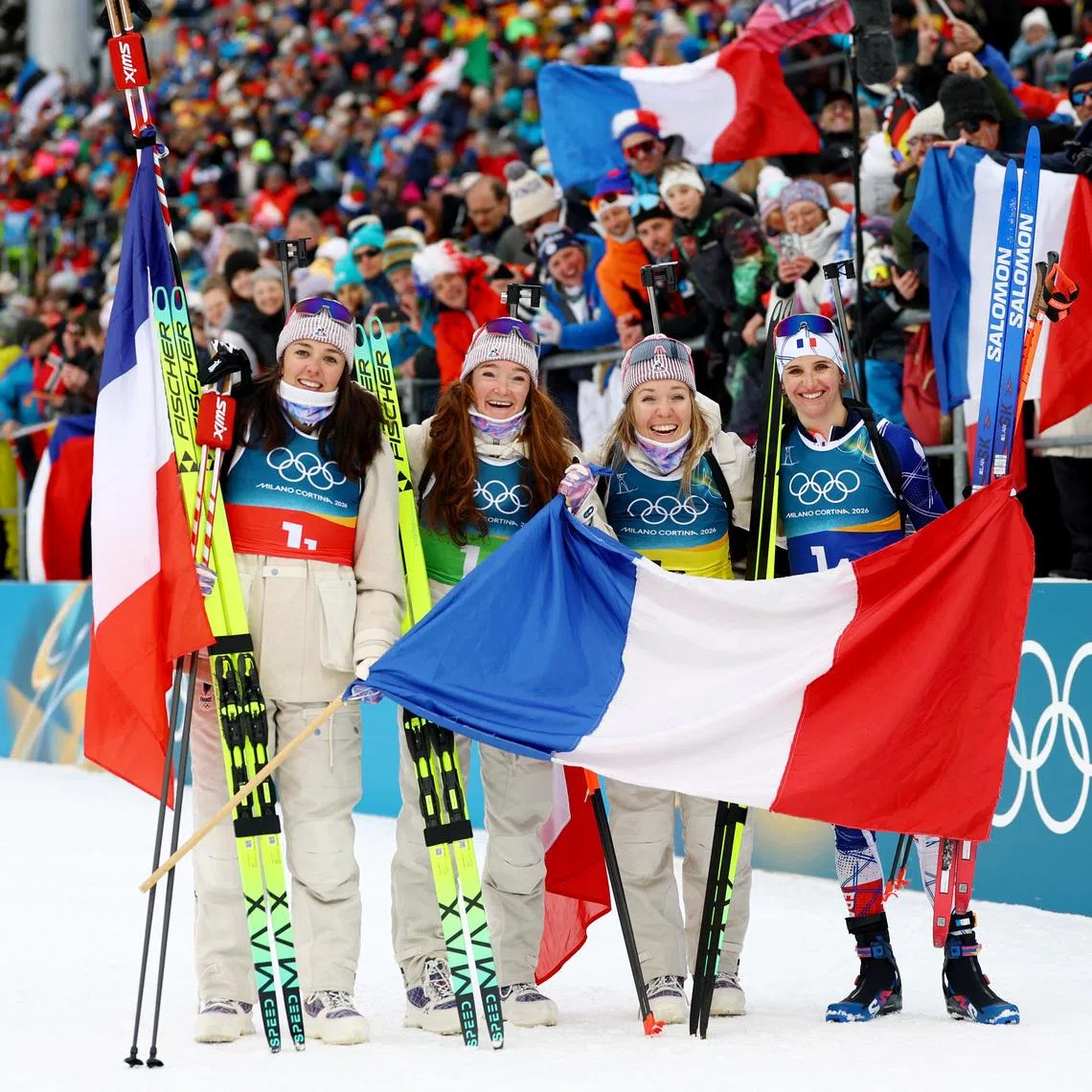 Milano Cortina 2026 Olympics - Biathlon - Women's 4 x 6km Relay - Anterselva Biathlon Arena, South Tyrol, Italy - February 18, 2026. Camille Bened of France, Lou Jeanmonnot of France, Oceane Michelon of France and Julia Simon of France  celebrate after winning the gold medal. REUTERS/Matthew Childs