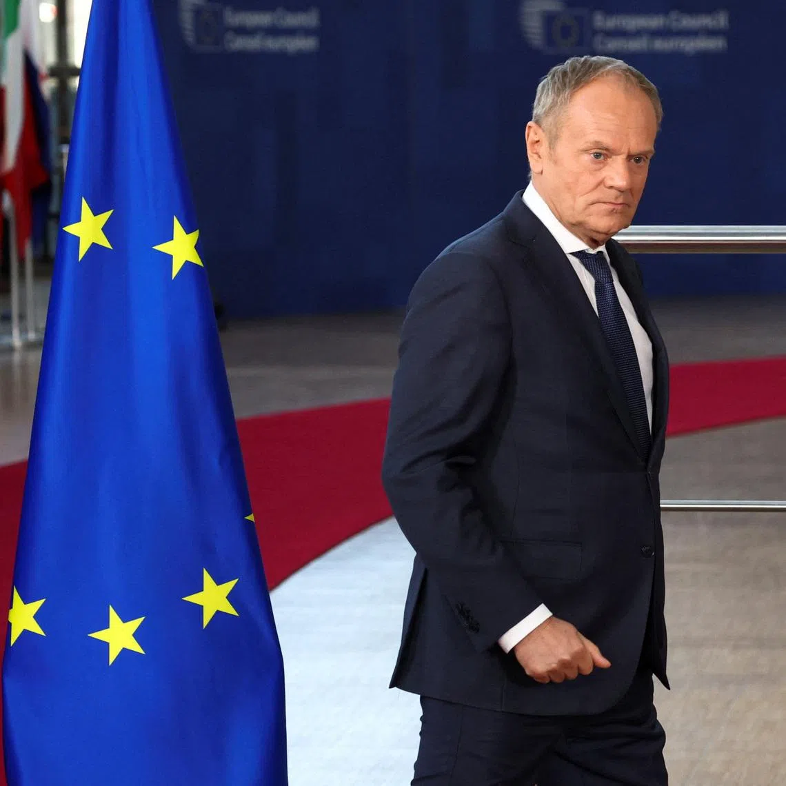 FILE PHOTO: Polish Prime Minister Donald Tusk walks on the day of a European Union leaders' summit in Brussels, Belgium March 19, 2026. REUTERS/Yves Herman/File Photo