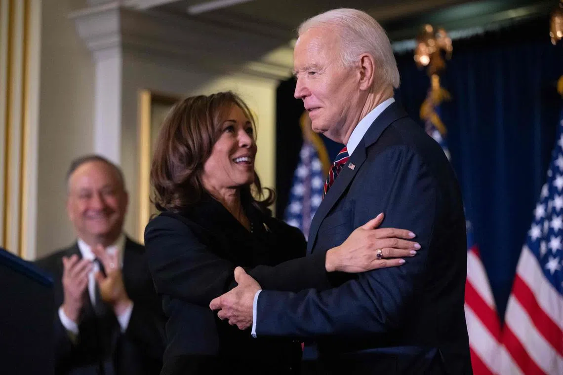 Ms Harris embraces Mr Biden at the Democratic National Committee's holiday reception in Washington DC.