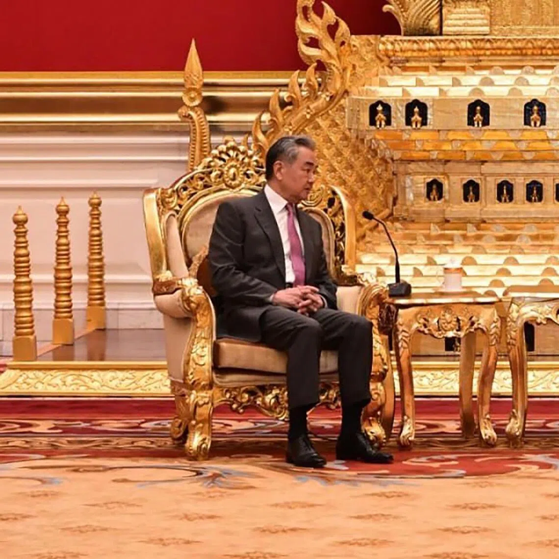 China’s Foreign Minister Wang Yi (left) speaking with Myanmar President Min Aung Hlaing during a meeting at the presidential house in Naypyitaw, Myanmar, on April 25.