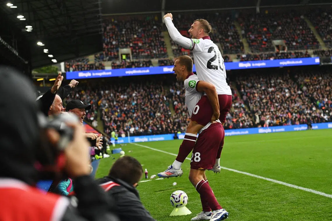 Jarrod Bowen leaping onto the shoulders of West Ham United teammate Tomas Soucek after the latter scored their first goal against Crystal Palace at Selhurst Park on Aug 24, 2024. Bowen later wrapped up their 2-0 win with the second goal.