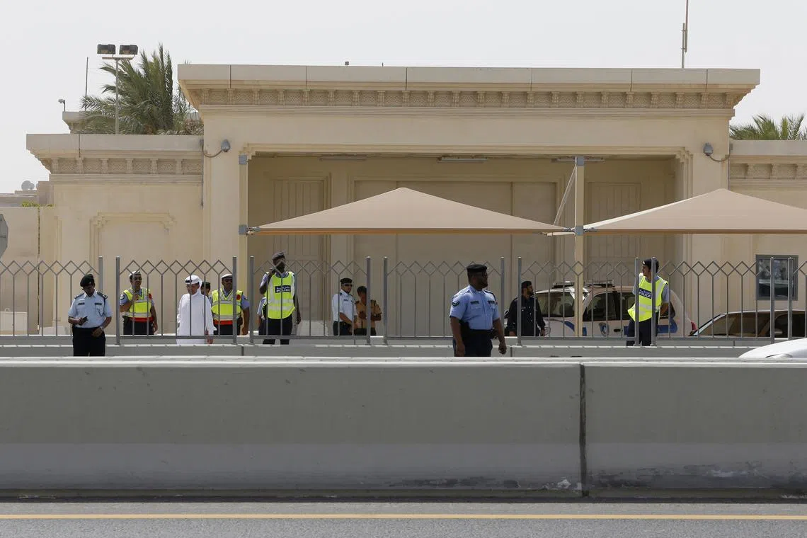 FILE PHOTO: Police officers stand guard in front of the U.S. embassy in Doha September 14, 2012. REUTERS/Fadi Al-Assaad/ File Photo
