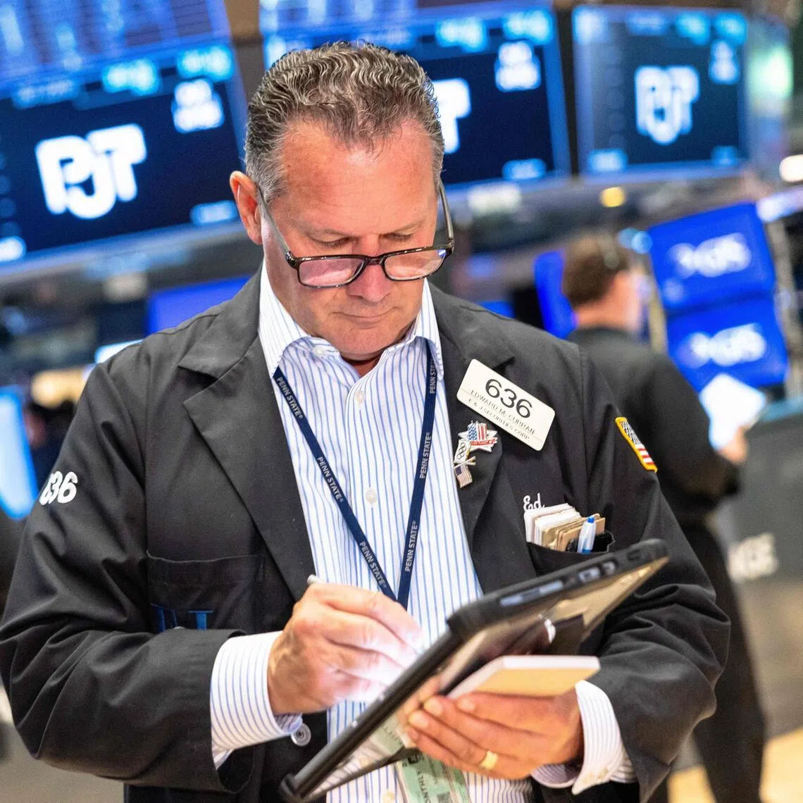 Traders working on the floor of the New York Stock Exchange during morning trading on July 17, in New York City.