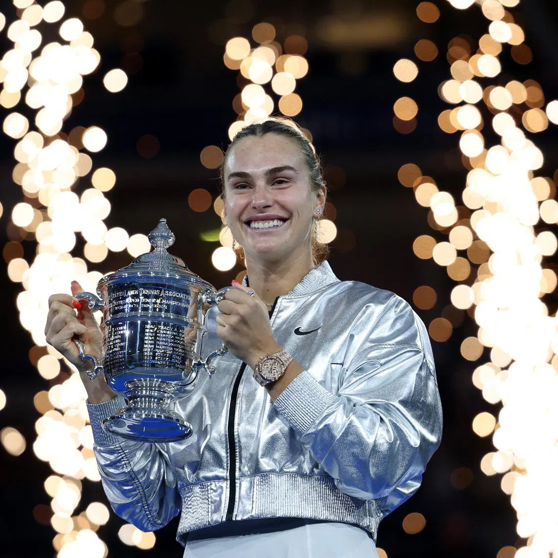 Tennis - U.S. Open - Flushing Meadows, New York, United States - September 6, 2025 Belarus' Aryna Sabalenka celebrates with the trophy after winning the women's singles final REUTERS/Mike Segar