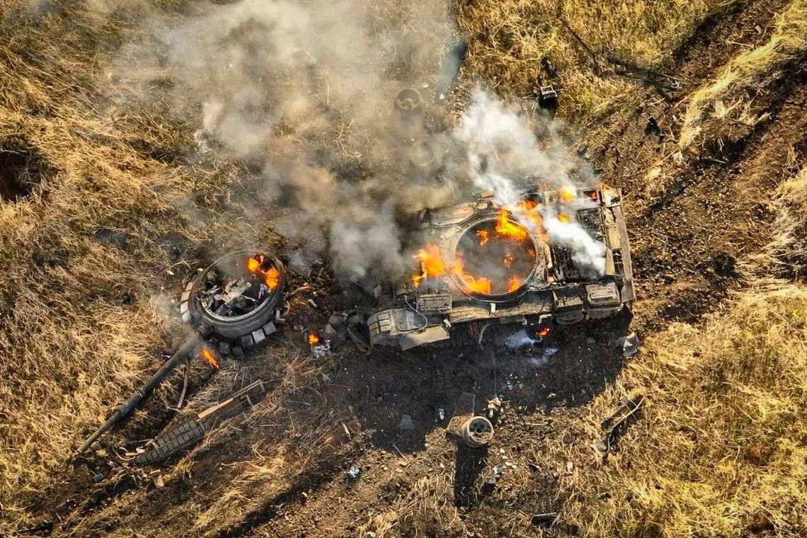 FILE PHOTO: A Russian tank burns in a field near the town of Vuhledar, amid Russia's attack on Ukraine, in Donetsk region, Ukraine in this handout picture released November 5, 2023. Press Service of the 72nd Black Zaporozhians Separate Mechanized Brigade of the Ukrainian Armed Forces/Handout via REUTERS