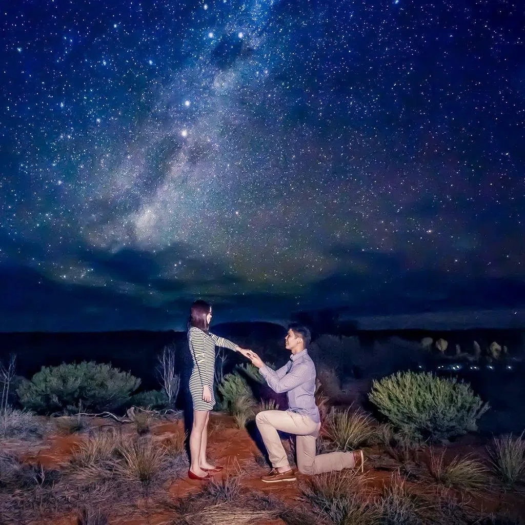 Sherman Sim proposing to his then-girlfriend Stefanie Tan in 2015 under the stars in the Australian outback, Uluru.