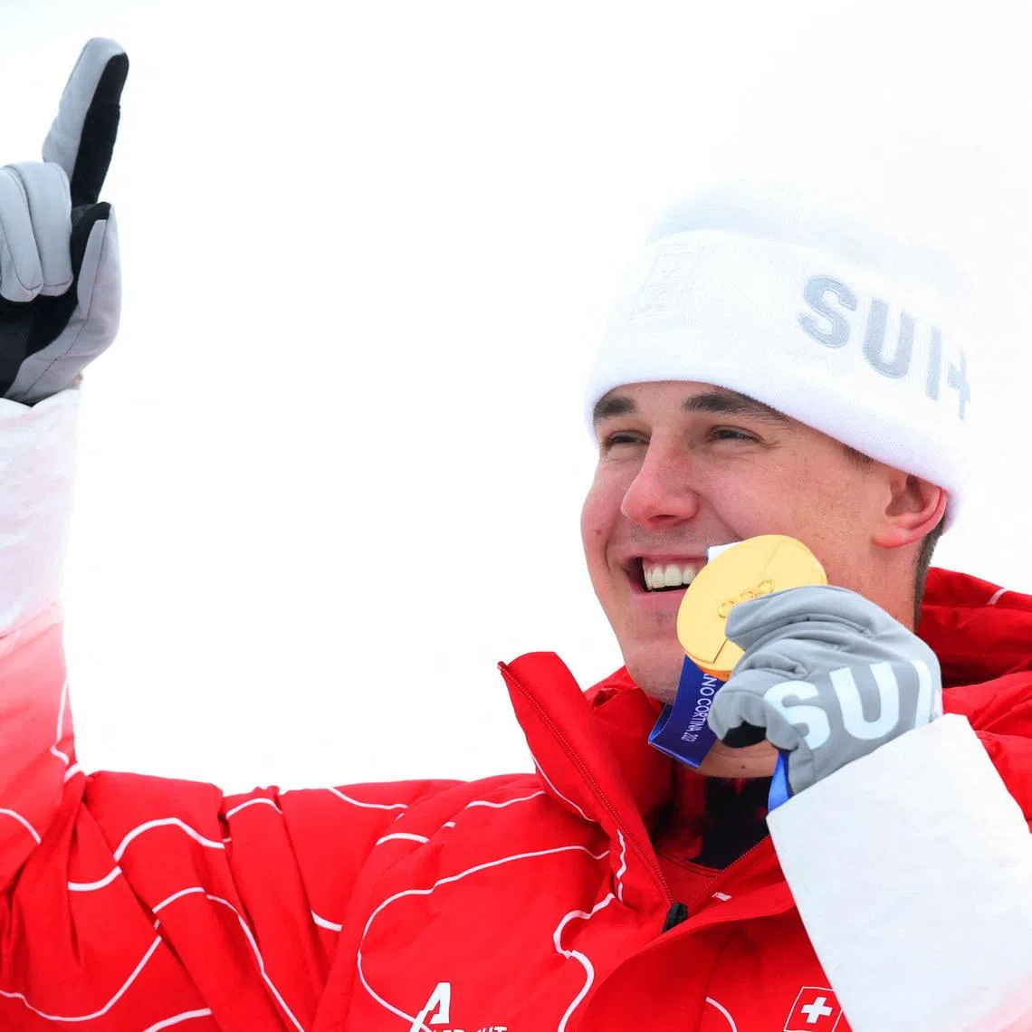 Milano Cortina 2026 Olympics - Alpine Skiing - Men's Super-G Victory Ceremony - Stelvio Ski Centre, Bormio, Italy - February 11, 2026. Gold medallist Franjo von Allmen of Switzerland celebrates on the podium during the victory ceremony REUTERS/Denis Balibouse