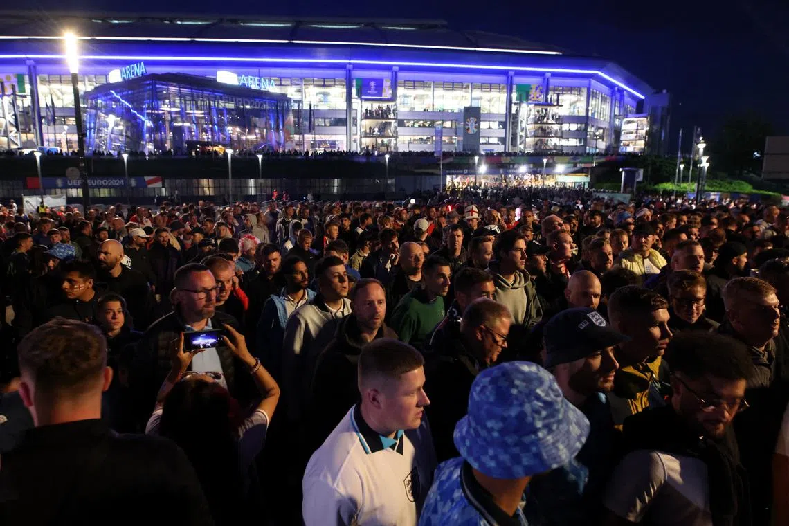 Soccer Football - Euro 2024 - Group C - Serbia v England - Arena AufSchalke, Gelsenkirchen, Germany - June 16, 2024 England fans leave the stadium after the match REUTERS/Thilo Schmuelgen