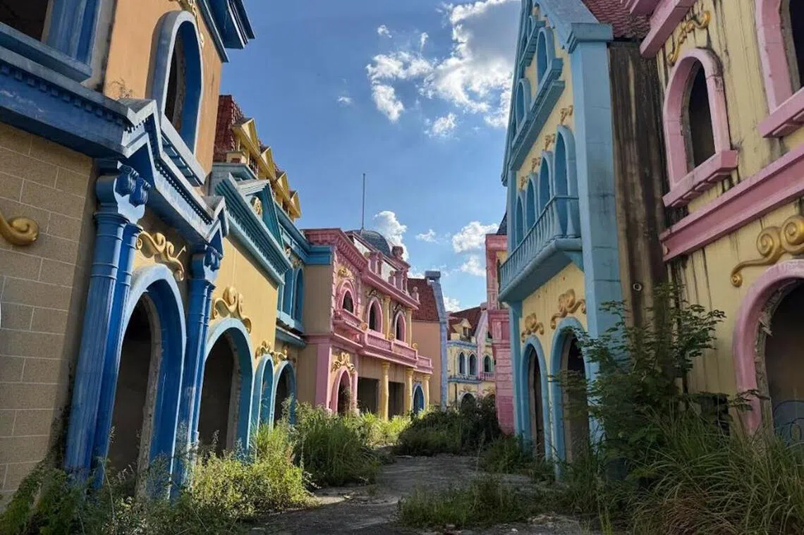 Rows of unfinished pastel-coloured buildings at the Evergrande Cultural Tourism City in Guiyang. But the crowds they were built to impress never came.