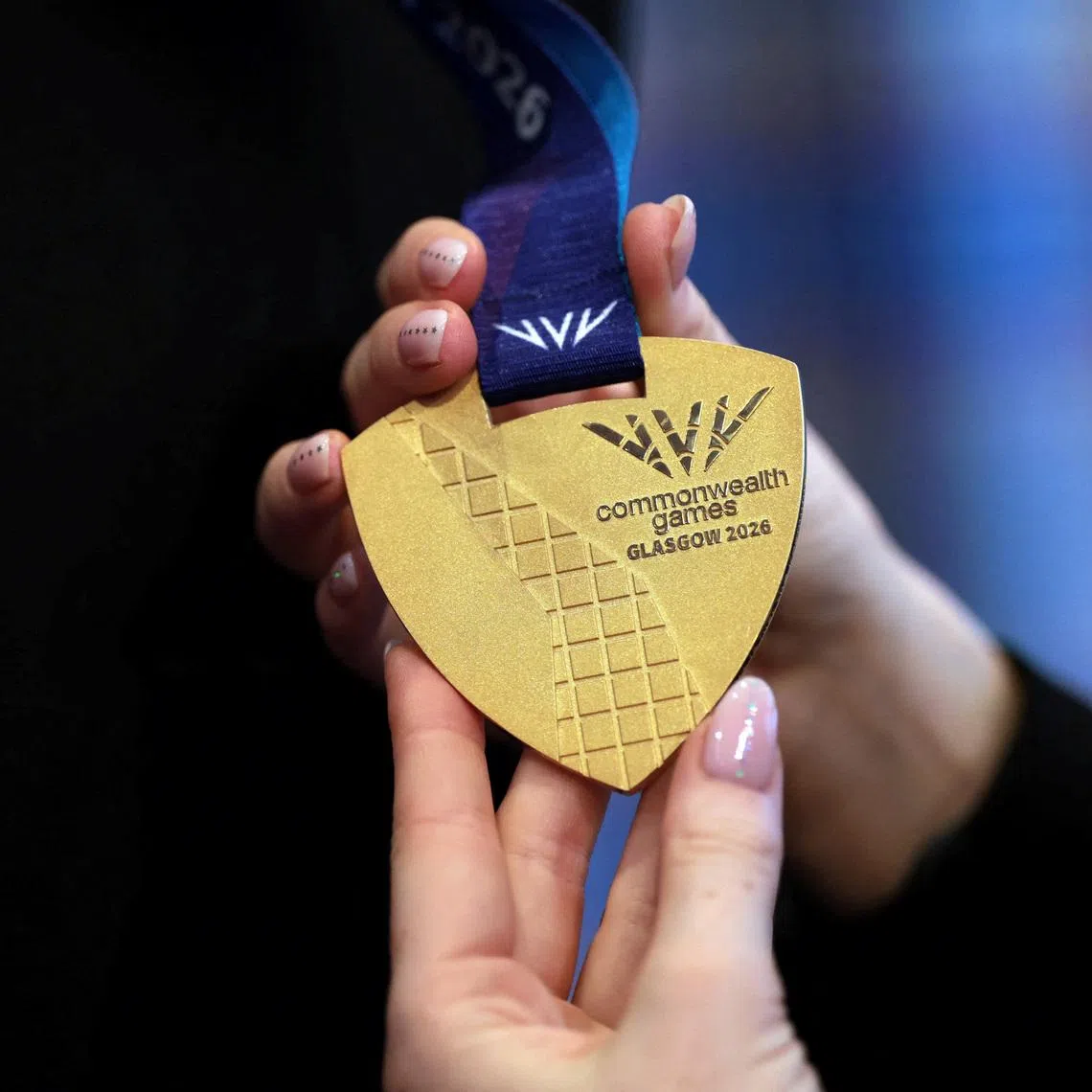 A detailed view shows the Official Medal for the 2026 Commonwealth Games, designed by Militsa Milenkova as it is unveiled at the Glasgow School Of Art in Glasgow, Scotland, April 29, 2026 .    Ian MacNicol/Pool via REUTERS