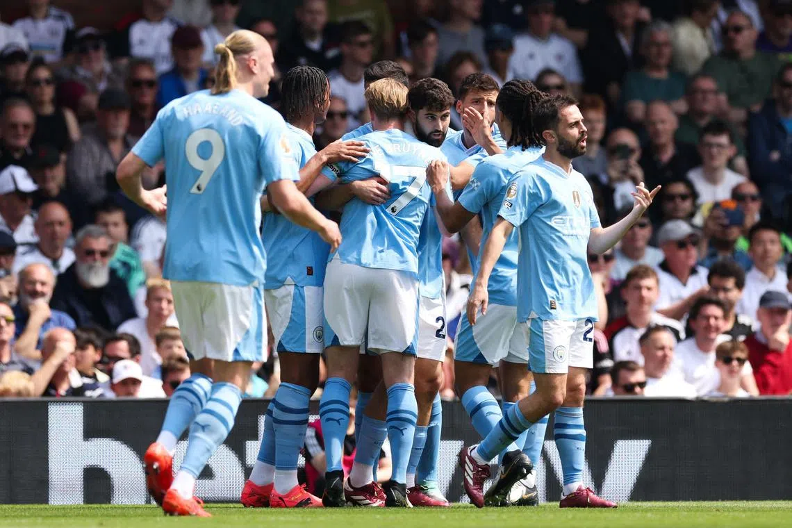 Manchester City defender Josko Gvardiol (centre) celebrates with teammates after opening the scoring against Fulham in the English Premier League.
