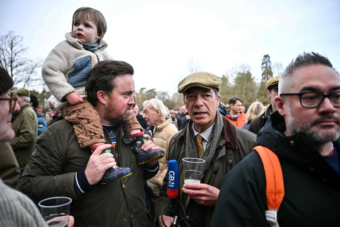 Former Leader of the Brexit Party, Nigel Farage (right) attending the Old Surrey, Burstow and West Kent annual Boxing Day hunt at Chiddingstone Castle, south of London, on Dec 26, 2023. 