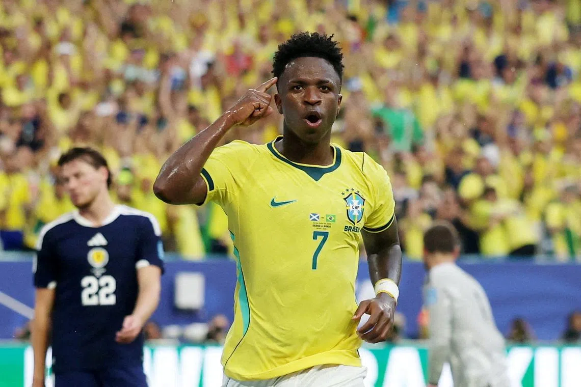 Brazil’s Vinicius Junior celebrates after scoring their second goal against Scotland on June 25.