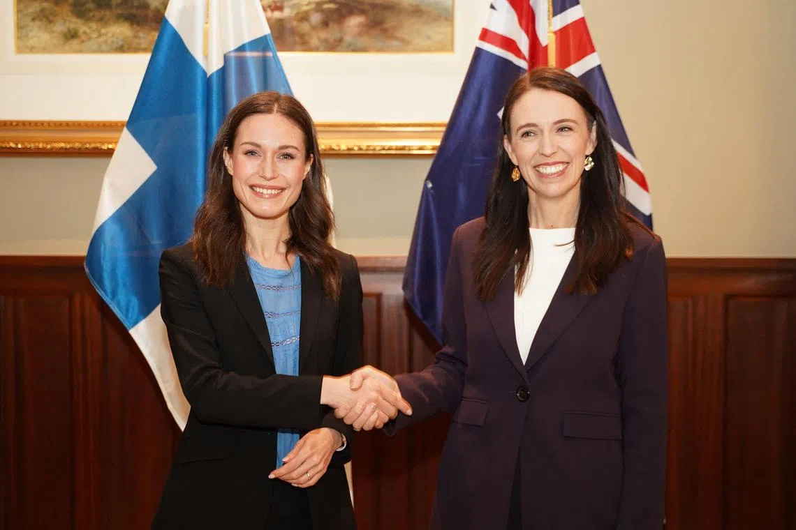 Finland’s Prime Minister Sanna Marin (L) shakes hands with New Zealand's Prime Minister Jacinda Ardern during a bilateral meeting in Auckland, New Zealand, on Nov 30.