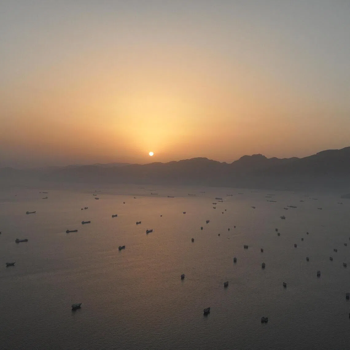 Vessels anchored in the Strait of Hormuz, as seen from Musandam, Oman, on May 30.