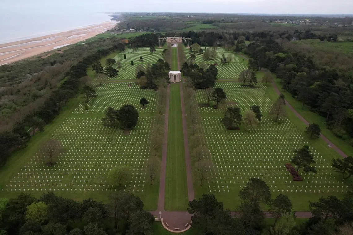 A drone view shows the World War II Normandy American Cemetery and Memorial at Colleville-sur-Mer, situated above Omaha Beach, Normandy region, France, April 11, 2024. REUTERS/Christian Hartmann/File Photo