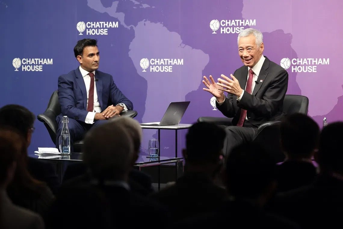 Senior Minister Lee Hsien Loong (right) speaking at the Chatham House dialogue on Oct 27.