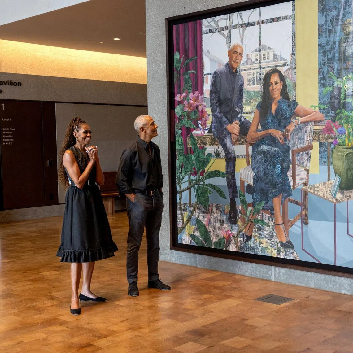 Former president Barack Obama and former first lady Michelle Obama with Nigerian-born visual artist Njideka Akunyili Crosby next to their first commissioned portrait by Crosby, at the Obama Presidential Center on June 14.