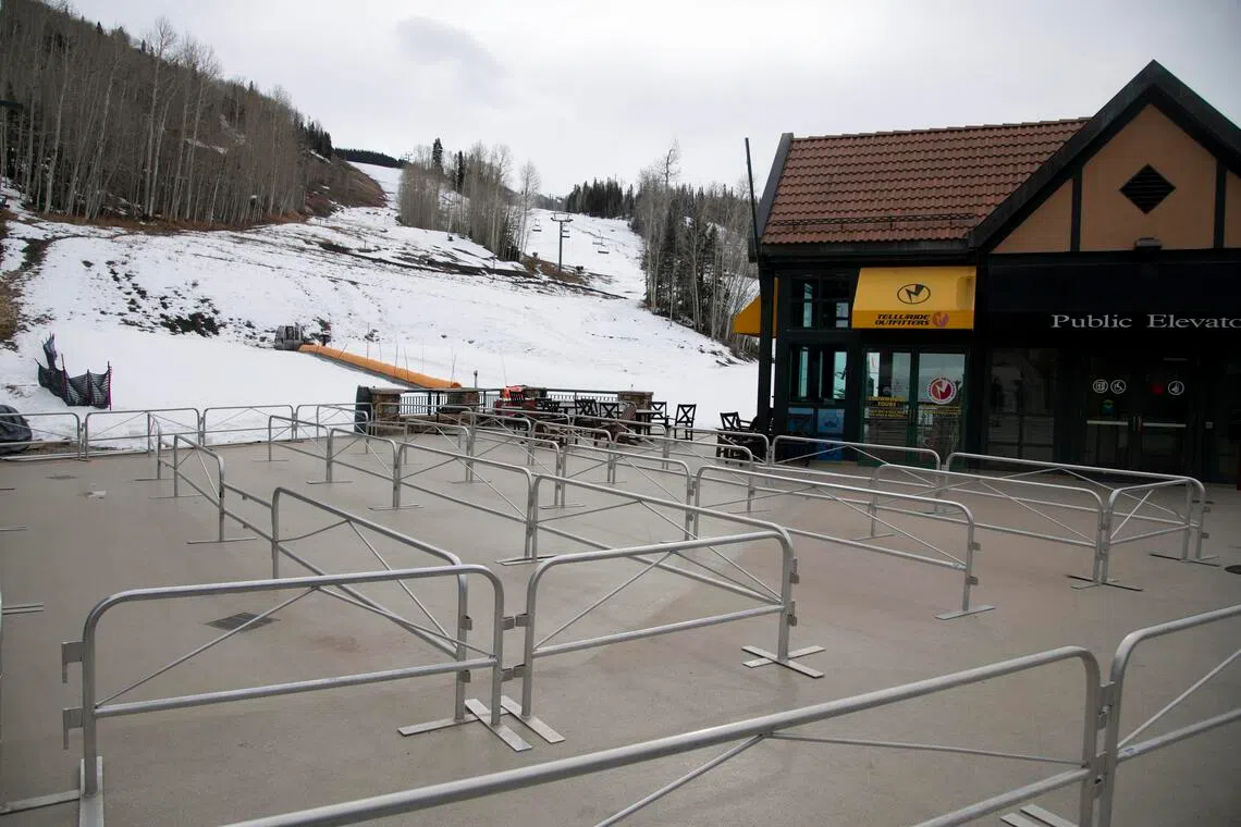 Queue lines sit empty during a shutdown at the Telluride Ski Resort in Mountain Village, Colorado in December 2025. Little snowpack, strikes by mountain staff and Trump administration policies that are keeping international visitors away have made this a difficult season in the Rockies and beyond. 