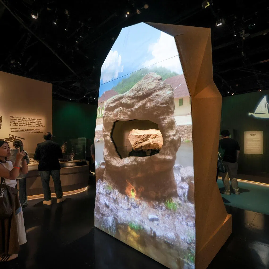 The Singapore Stone wrapped in digital renderings of the past at the revamped Singapore History Gallery at the National Museum of Singapore, opening to the public on Oct 10.