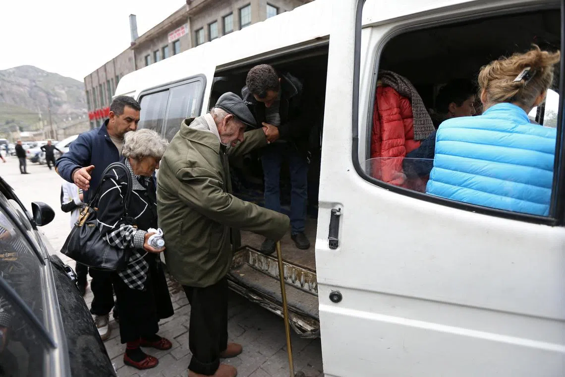 Refugees from Nagorno-Karabakh region arrive at a temporary accommodation centre in the town of Goris, Armenia.