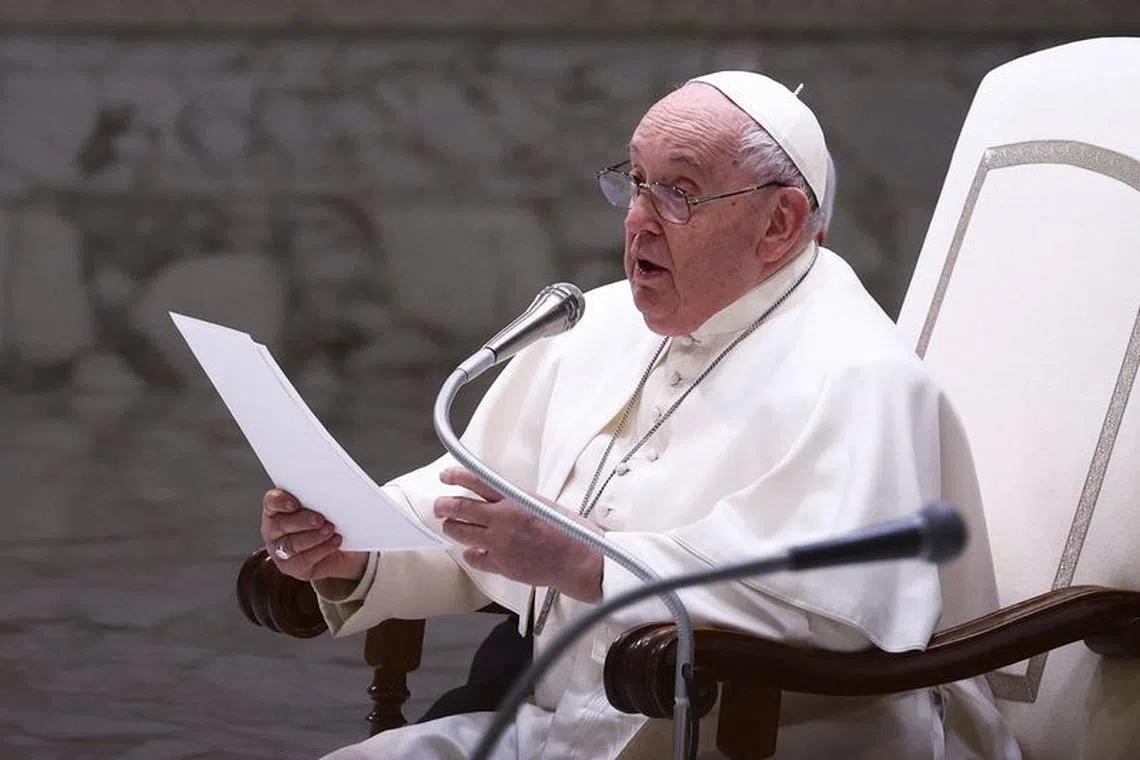 Pope Francis speaks at the weekly general audience, in Paul VI hall at the Vatican, February 14, 2024. REUTERS/Guglielmo Mangiapane
