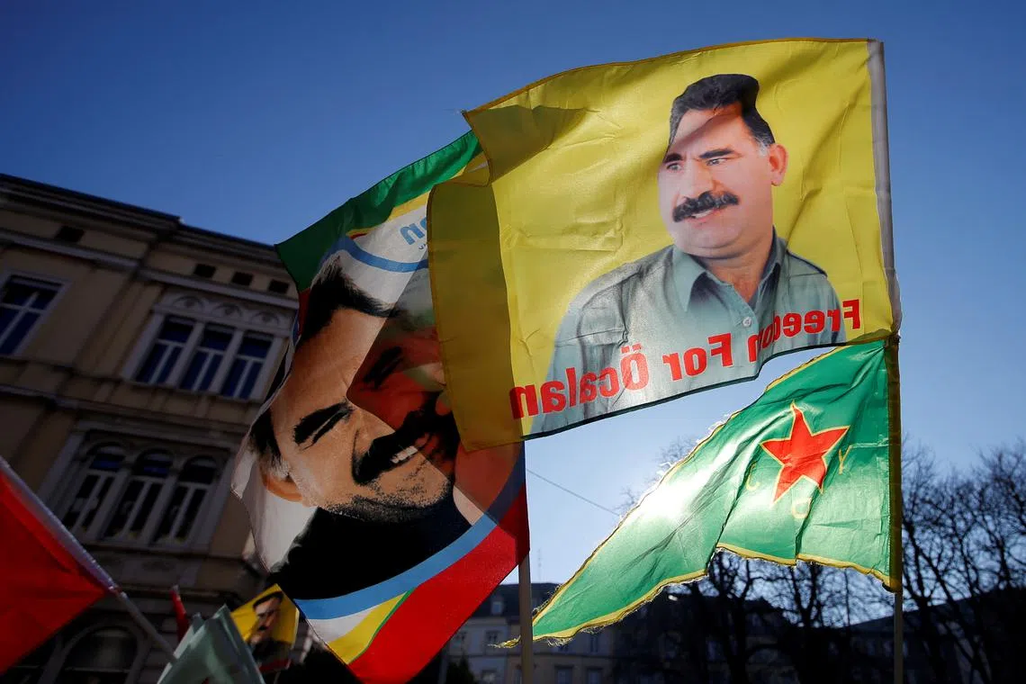 Pro-Kurd protesters hold flags with portraits of jailed Kurdistan Workers Party (PKK) leader Abdullah Ocalan as they take part in a demonstration in support to him in Strasbourg, France, February 16, 2019. REUTERS/Vincent Kessler/File Photo