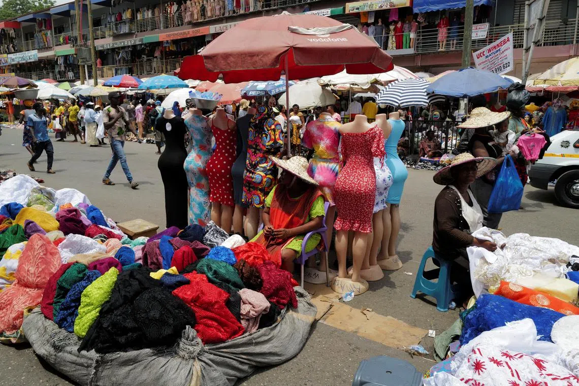 FILE PHOTO: Vendors are seen along of a street at Makola market, one of the country's largest trading centres in Accra, Ghana March 26, 2022. REUTERS/Francis Kokoroko