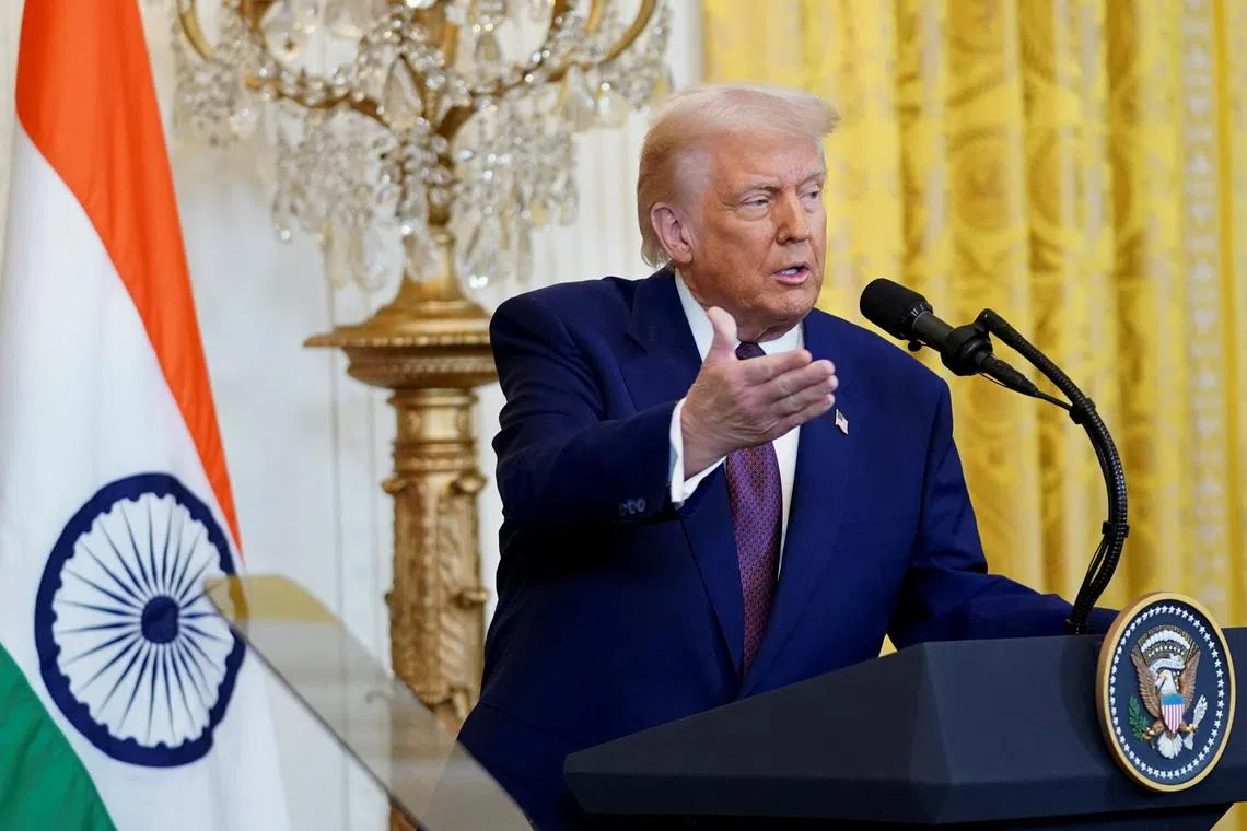 U.S. President Donald Trump speaks during a joint press conference with Indian Prime Minister Narendra Modi at the White House in Washington, D.C., U.S., February 13, 2025. REUTERS/Nathan Howard