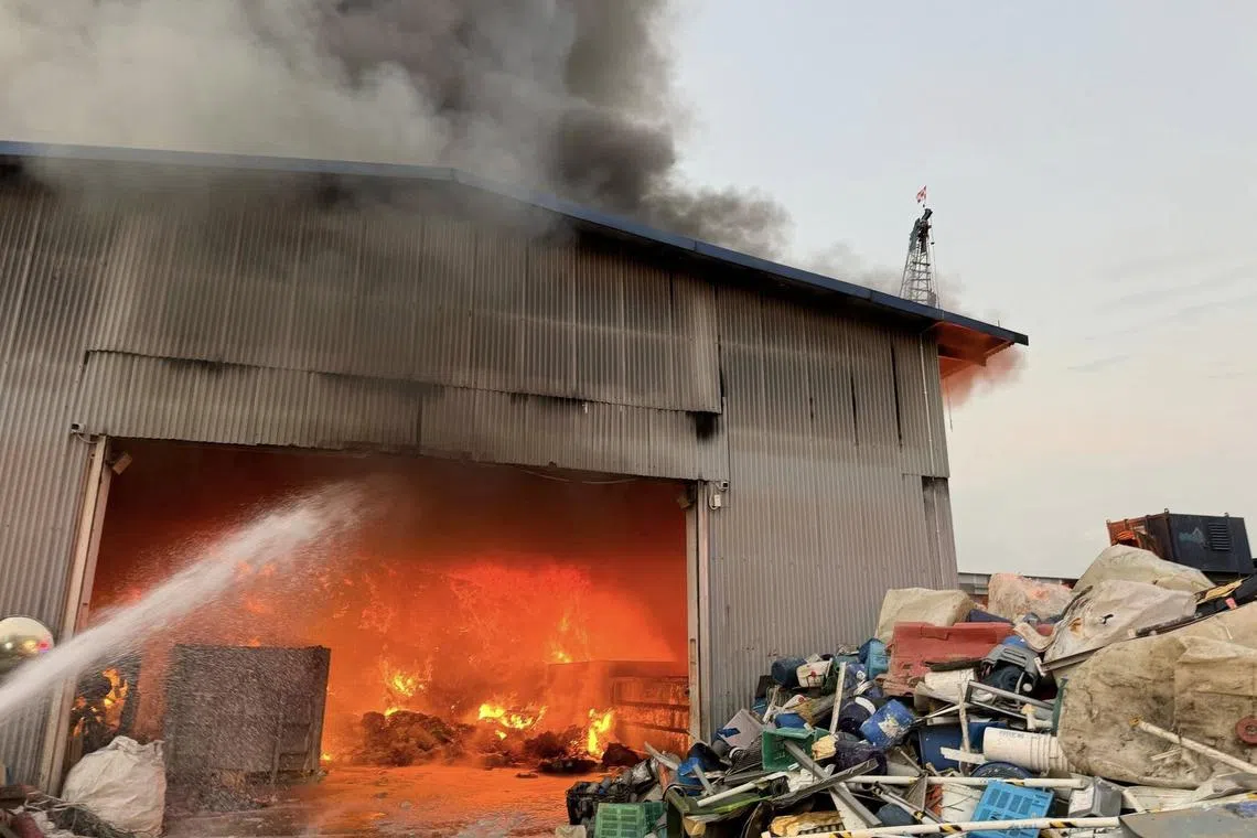 Firefighters putting out a fire at a warehouse