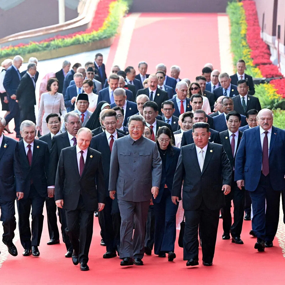 Chinese President Xi Jinping, flanked by Russian President Vladimir Putin and North Korean leader Kim Jong Un, leading world leaders in Beijing on Sept 3.